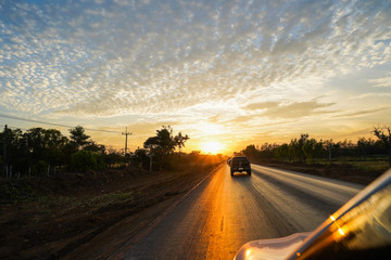 Naklejka premium road in the sunset