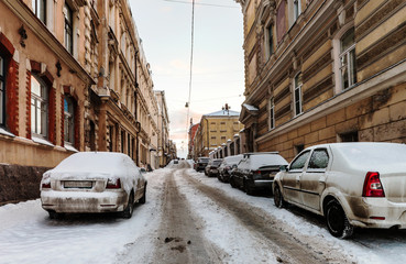 old snow-covered streets of the city. Winter cityscape of the old town