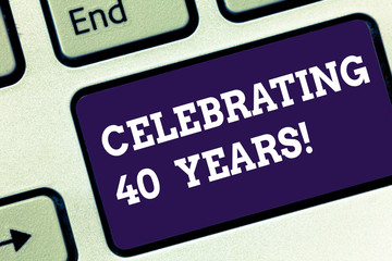 Handwriting text Celebrating 40 Years. Concept meaning Honoring Ruby Jubilee Commemorating a special day Keyboard key Intention to create computer message pressing keypad idea