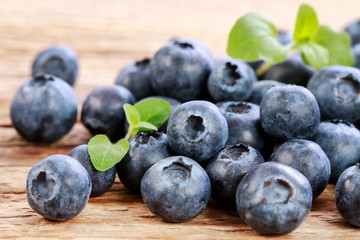 Blueberries on wooden table.