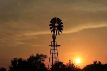 windmill at sunset with colorful sky