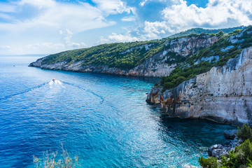 Greece, Zakynthos, North cape skinari coast covered by green plants alongside pretty clear ocean water