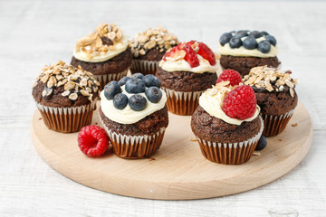 Muffins decorated with fresh fruits