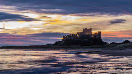 sunrise with dramatic sky at northumberland coastline