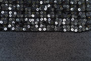 black shiny fabric with sequins lined background