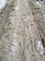 Traces of cars on the road in winter