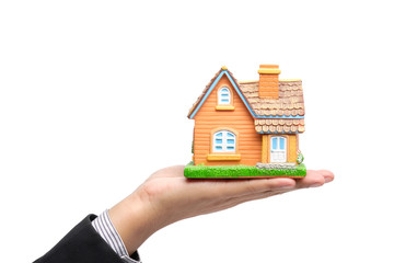 Businessman's hand is holding a model house. Clipping path