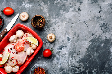 Raw chicken breasts and mushrooms