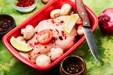 Raw chicken in baking dish