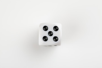 Single white with black dots dice on a white background, showing number five