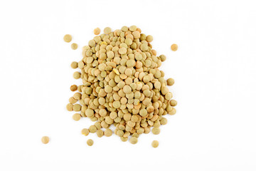 Pile of green lentils on a white background