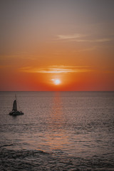 Fototapeta premium Boat sailing during beautiful sunset, Thailand