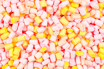 Marshmallow. Background of pink and yellow colorful mini marshmallows.
