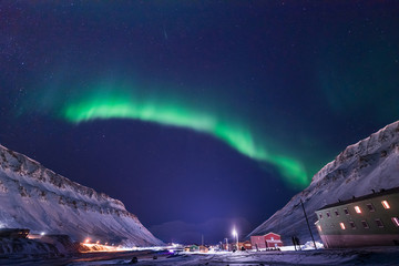 Naklejka na ściany i meble The polar arctic Northern lights aurora borealis sky star in Norway travel Svalbard in Longyearbyen city the moon mountains