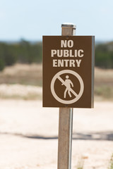 No Public Entry - prohibited or restricted area safety warning sign for not trespassing on blurred background