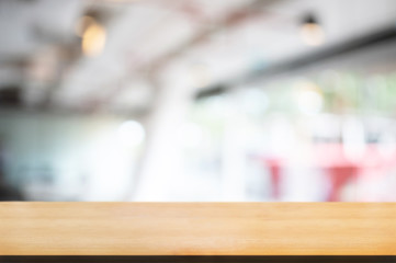 empty wood table with blur montage coffee shop cafe background