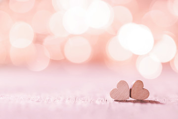 Pink hearts on bokeh background