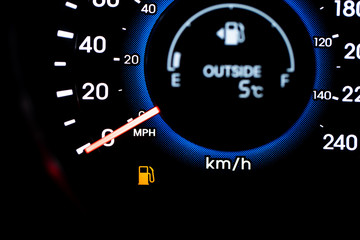 A Vehicles low fuel light and gauges