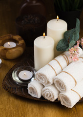 Spa still life with aromatic candles, flower and towel. - Image.