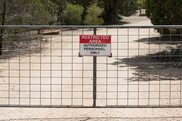 Restricted Area, Authorised Personnel Only  - safety warning sign for not trespassing on blurred background