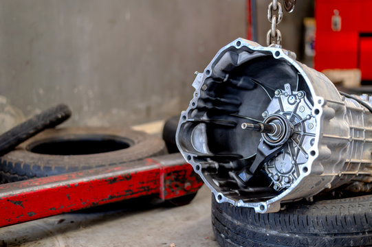 car automatic transmission part in repair shop with soft-focus and over light in the background