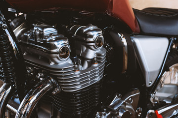 closeup motorcycle engine with soft-focus and over light in the background - obrazy, fototapety, plakaty