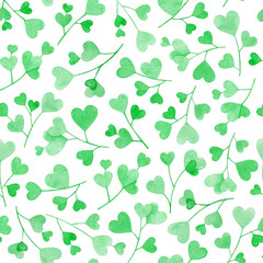 Seamless pattern with watercolor branches with green heart shaped leaves on white background.