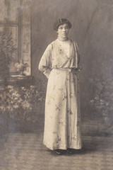 RUSSIA - CIRCA 1905-1910: Full body shot of young woman in studio, Vintage Carte de Viste Edwardian era photo