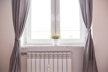 Window and radiator. Heating and interior