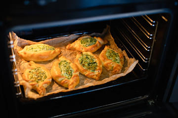 Georgia adjarian Khachapuri with spinach and cheese filling in oven