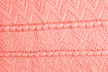 Texture of knitted coral fabric.