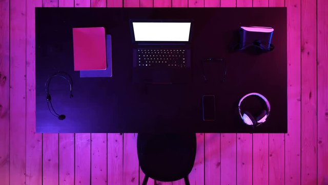 Gamer workspace concept with gamer's laptop screen seen. White Display.