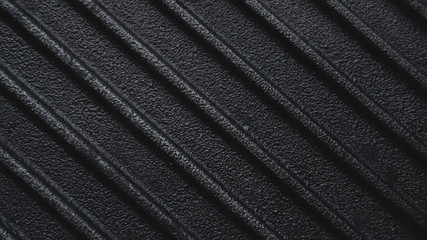 Black rough cast iron griddle grill pan ribbed background