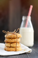 Fototapeta na wymiar Homemade almond cookies stacked in a rusting dark background