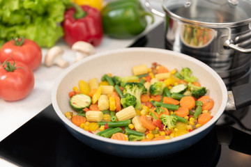 Fresh vegetables fried in a pan. Healthy nutrition concept