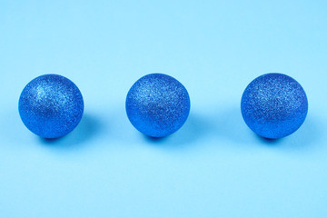 Blue spheres on pastel background.