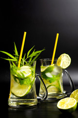 Lime cocktail with marijuana in a glass