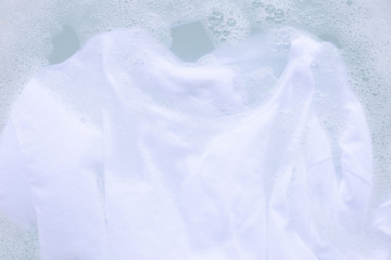 Soak cloth before washing, white t-shirt