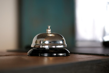 Hotel reception counter desk with service bell.