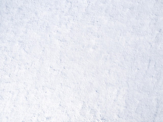 texture of white fresh snow sparkling in the sun, natural winter background