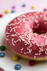 Obraz na płótnie Canvas donuts in strawberry glazed