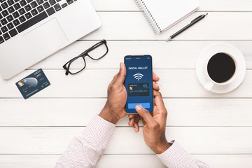 Man using smartphone with digital wallet application