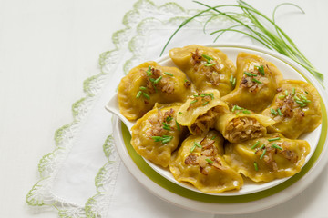 Dumplings with cabbage and fried onions. This is a very popular food in Poland, Ukraine and Russia