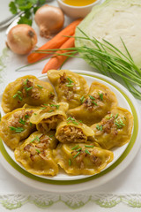 Dumplings with cabbage and fried onions. This is a very popular food in Poland, Ukraine and Russia
