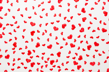 Valentines day background red hearts on wooden background.