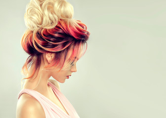 Beautiful model girl  with elegant  multi colored hairstyle . Stylish Woman with fashion  hair  color highlighting.   Creative  red and pink roots ,   trendy  coloring.    © Sofia Zhuravetc