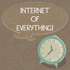 Writing note showing Internet Of Everything. Business photo showcasing network of things interact and connecting each other Blank Color Thought Speech Bubble with Outline and Alarm Clock photo