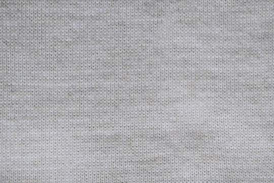 Grey knitted background. Surface wool texture. Copy space for your text