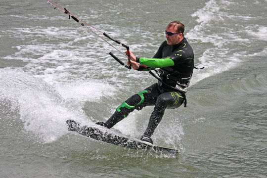 kitesurfer riding his board