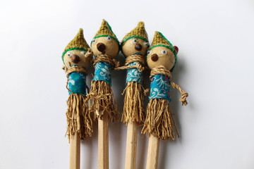 A traditional pencil with a scarecrow as decoration
